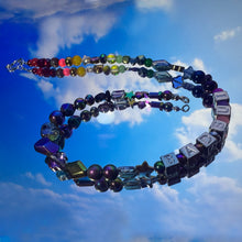 Load image into Gallery viewer, Colorful beaded necklace with letter beads against a blue sky background